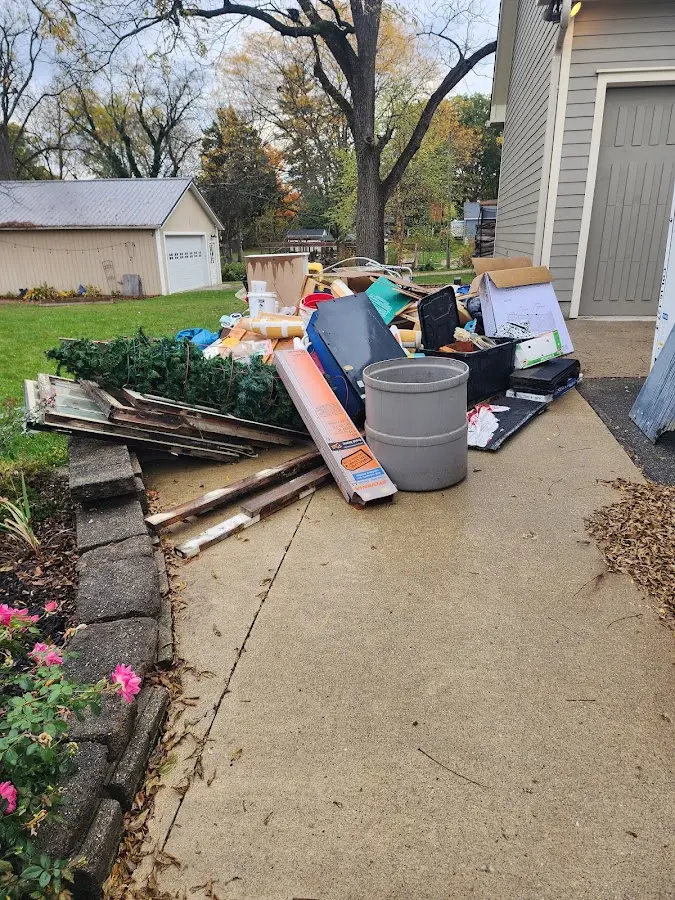 Dumpster being loaded with debris for Residential Dumpster Rental in South Boston
